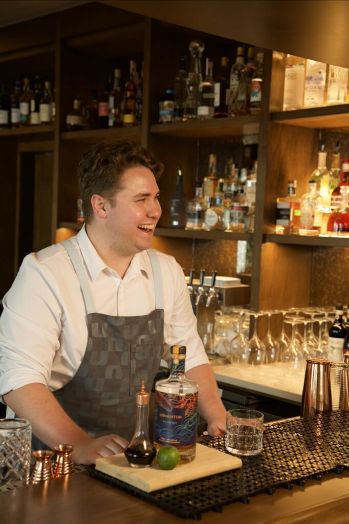 man behind bar at Duna Bar making cocktails Tiki Cocktails at Wrightsville Beach