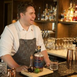 man behind bar at Duna Bar making cocktails Tiki Cocktails at Wrightsville Beach