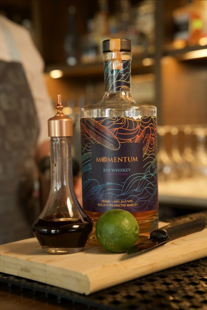 bottle of momentum rye on a bar